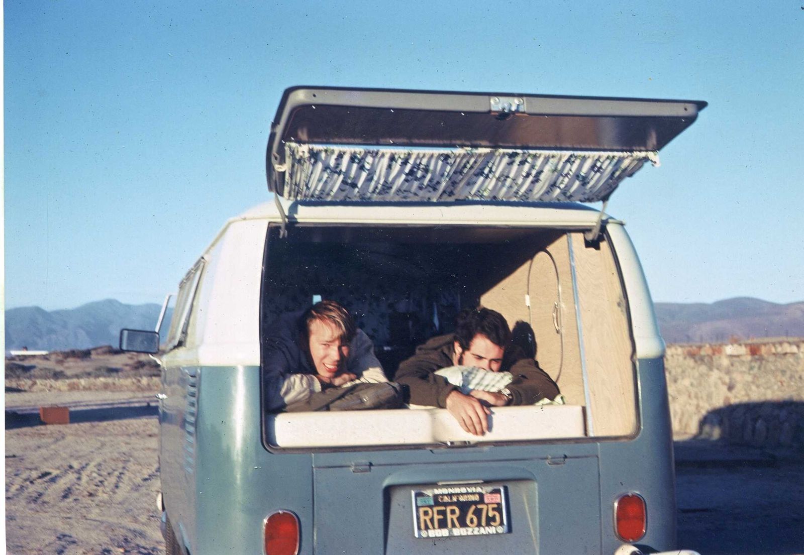 Young Steve Hauser and Al lying in the back of a VW bus