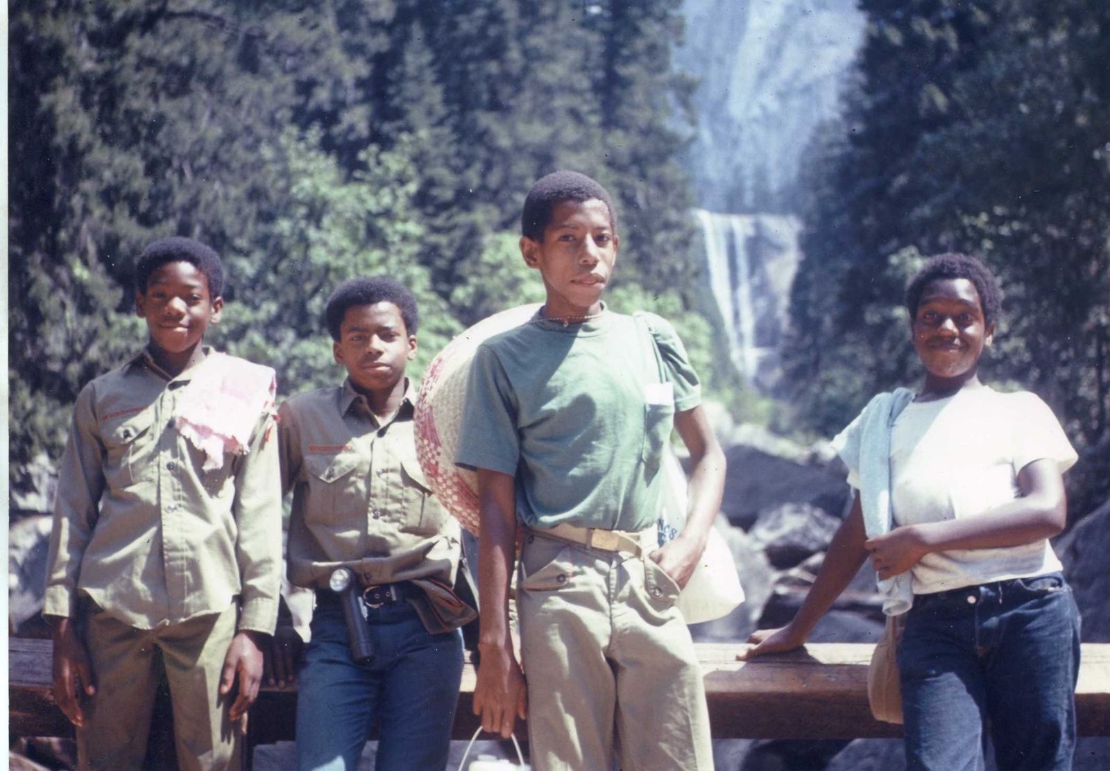 Four scouts in front of a waterfall in Yosemite